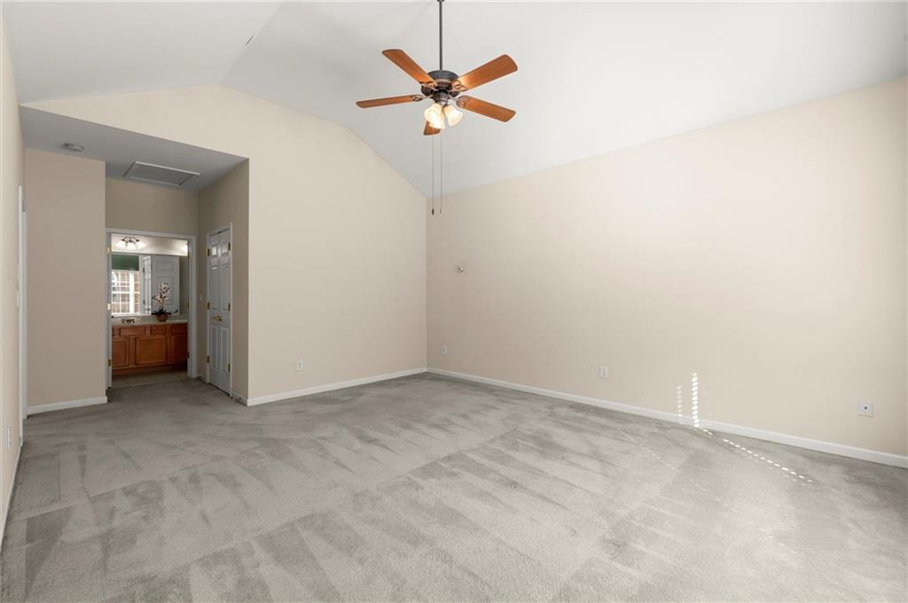 3361 Raes Creek Road, Unit 8 Marietta, GA 30008 - Photo 13 of 27 an empty room with a ceiling fan and a window