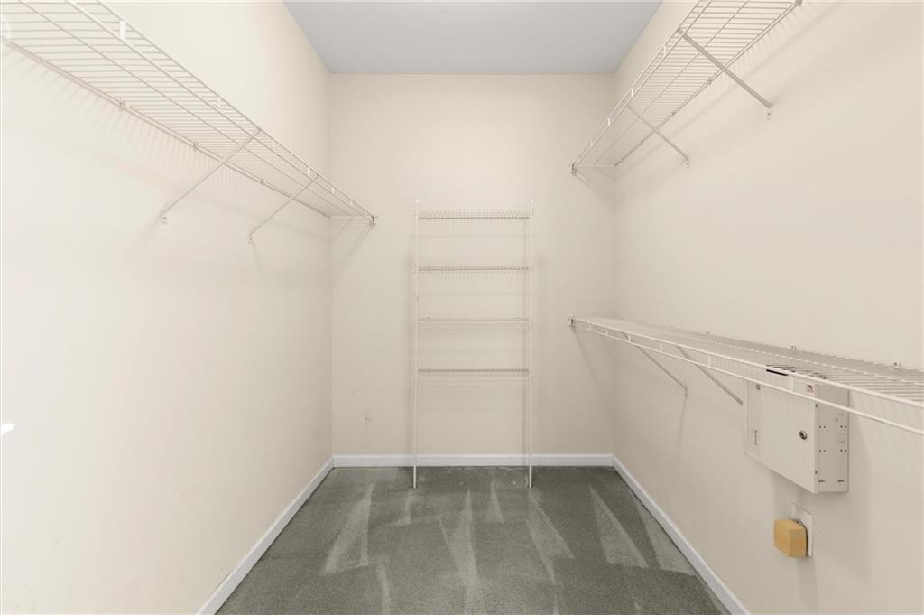 3361 Raes Creek Road, Unit 8 Marietta, GA 30008 - Photo 14 of 27 a view of a room with racks on the wall