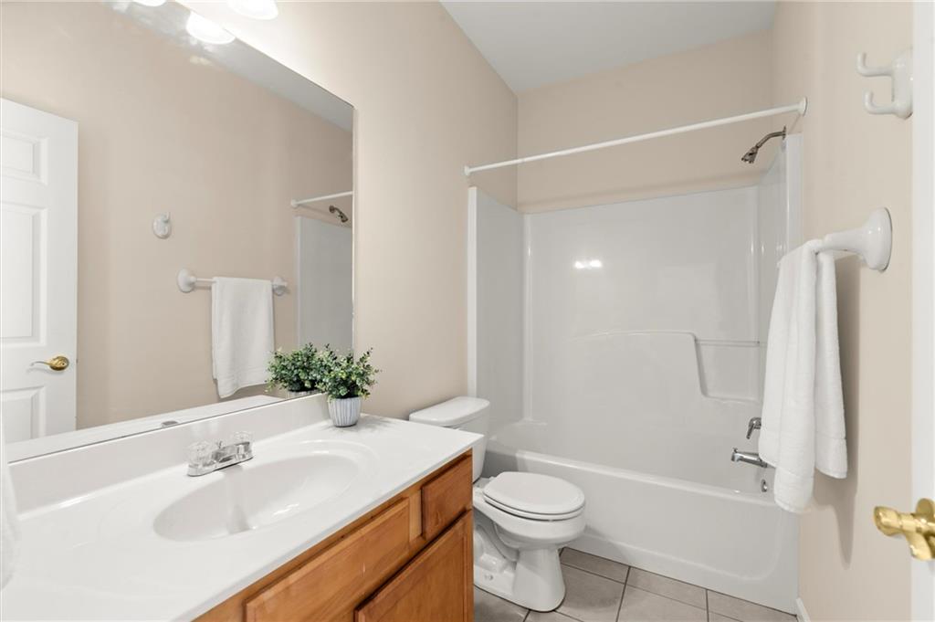 3361 Raes Creek Road, Unit 8 Marietta, GA 30008 - Photo 18 of 27 a bathroom with a sink toilet and shower