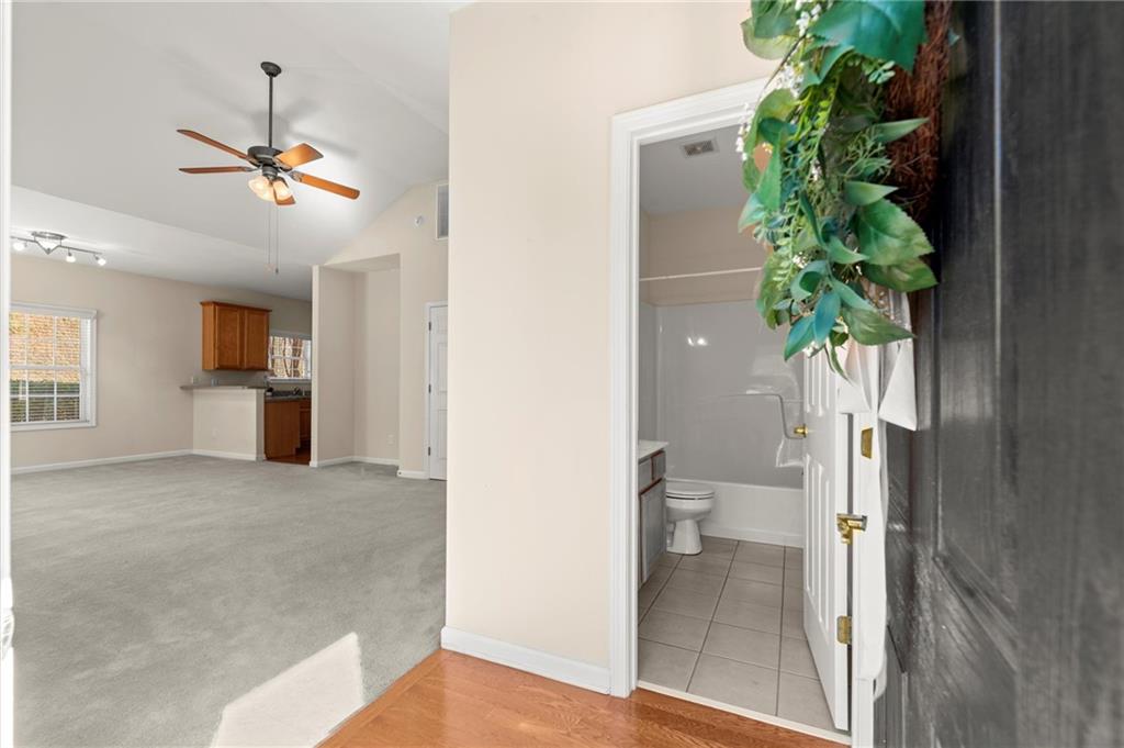 3361 Raes Creek Road, Unit 8 Marietta, GA 30008 - Photo 3 of 27 a view of a hallway with a potted plant