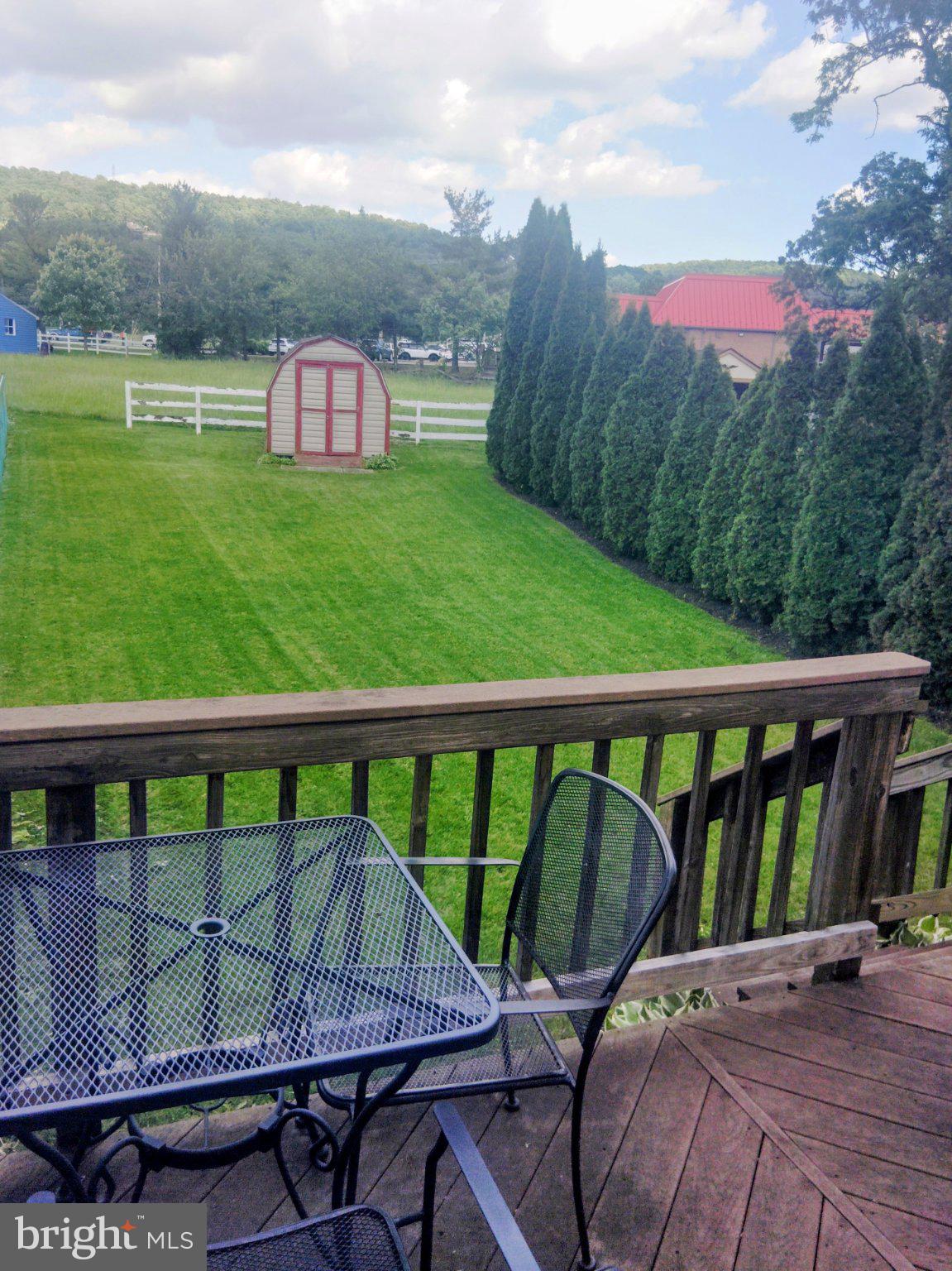 69 Johnson Smithsburg, MD 21783 - Photo 6 of 39 a view of a chairs and table in the balcony