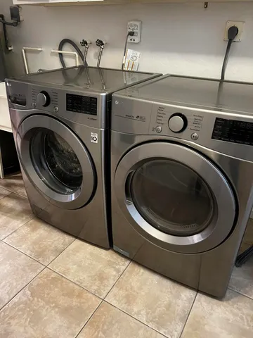 a utility room with dryer and washer