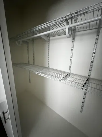 a view of a room with rack on the wall