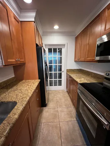 a kitchen with a stove and a sink