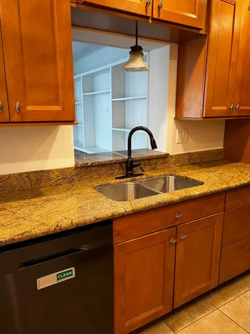 a close view of sink and cabinets