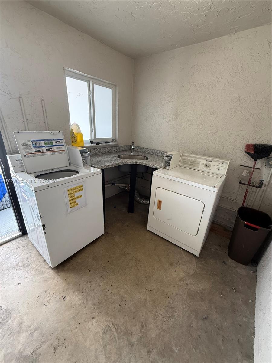 6841 Pembroke Road, Unit 15 Pembroke Pines, FL 33023 - Photo 16 of 16 a utility room with dryer and washer
