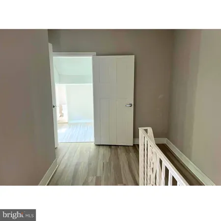 a living room with a couch and large window