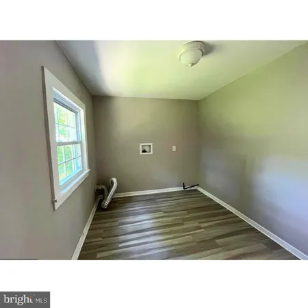 a kitchen with a table and chairs