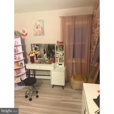 a bathroom with a sink mirror and vanity