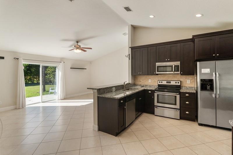 18916 93rd Road North Loxahatchee, FL 33470 - Photo 5 of 20 Kitchen into Family Room