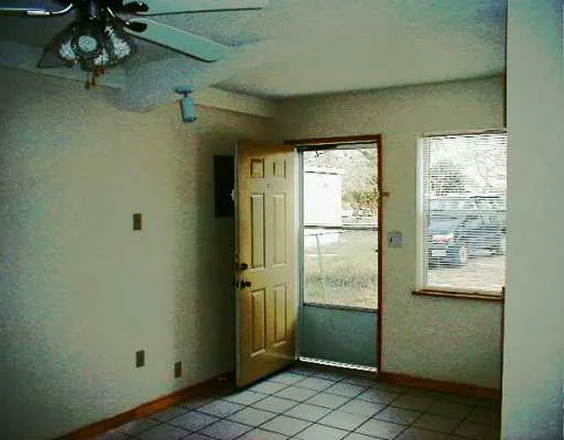 a view of a bathroom with a shower and a sink