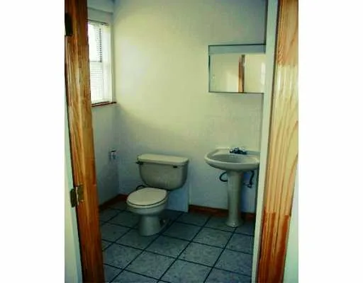 a bathroom with a toilet and a sink