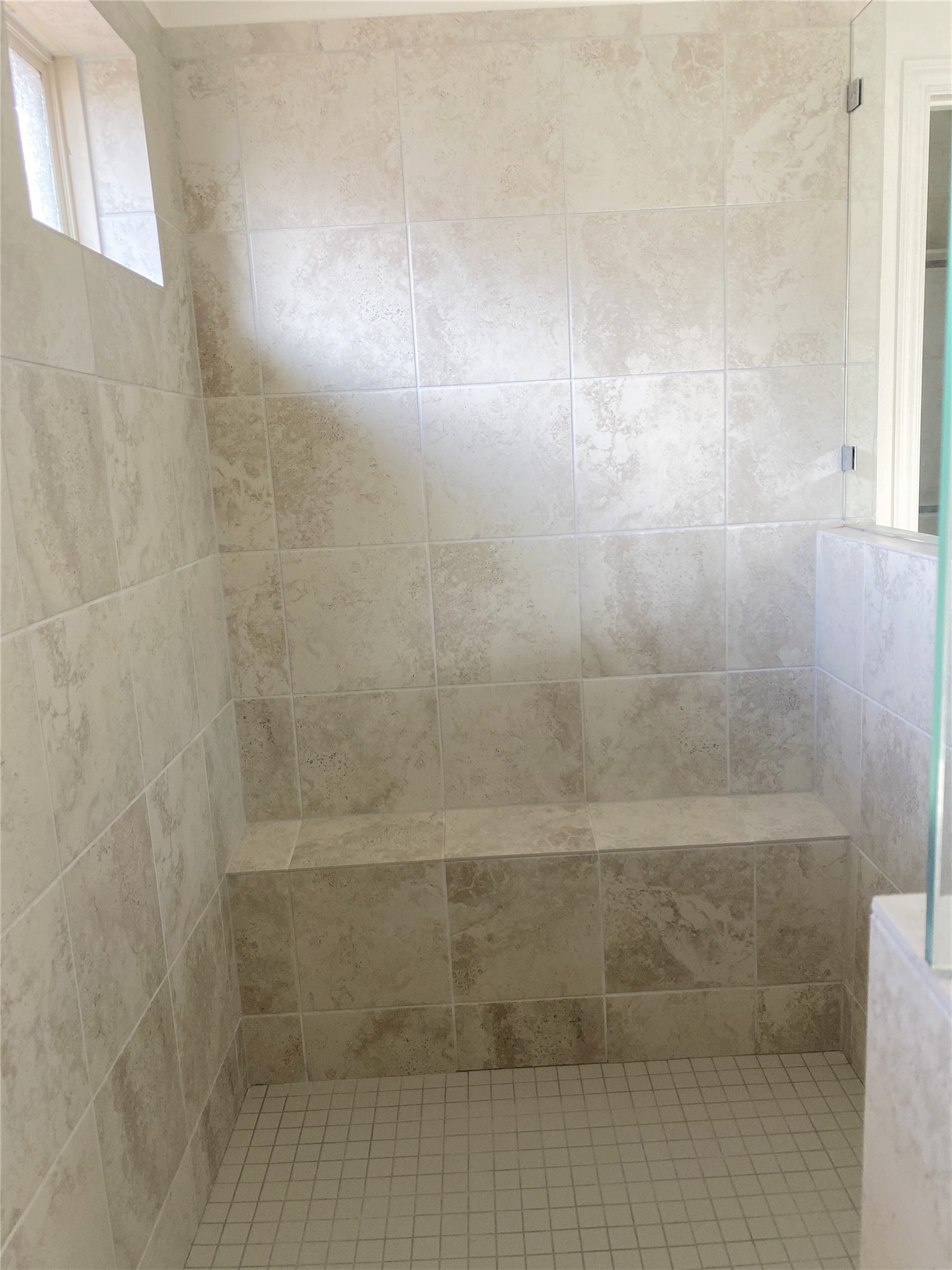 1309 Terrace View Georgetown, TX 78628 - Photo 20 of 36 Step into this spacious, naturally illuminated shower with a convenient integrated bench.