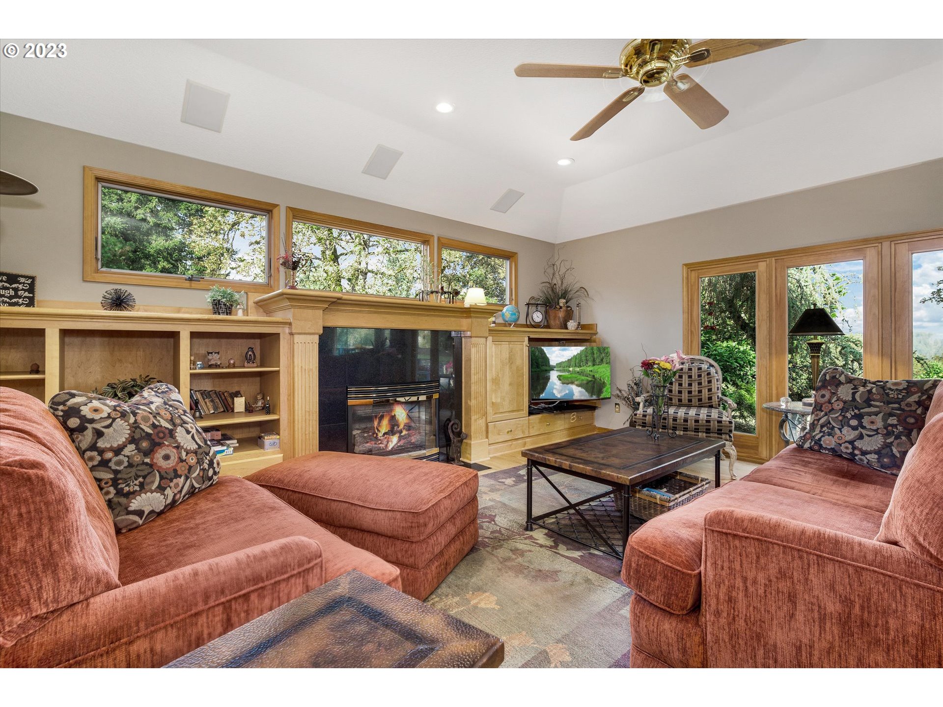 21100 South Summit Ridge Lane Oregon City, OR 97045 - Photo 13 of 32 a living room with furniture fireplace and a large window