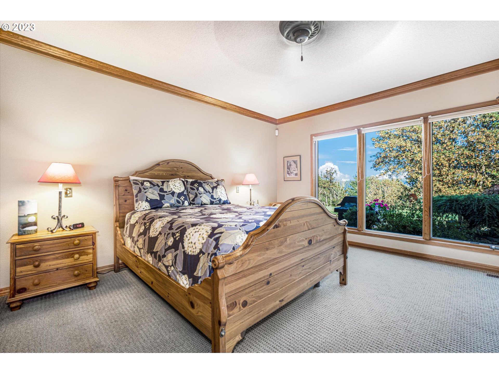 21100 South Summit Ridge Lane Oregon City, OR 97045 - Photo 20 of 32 a bed sitting in a bedroom next to a window