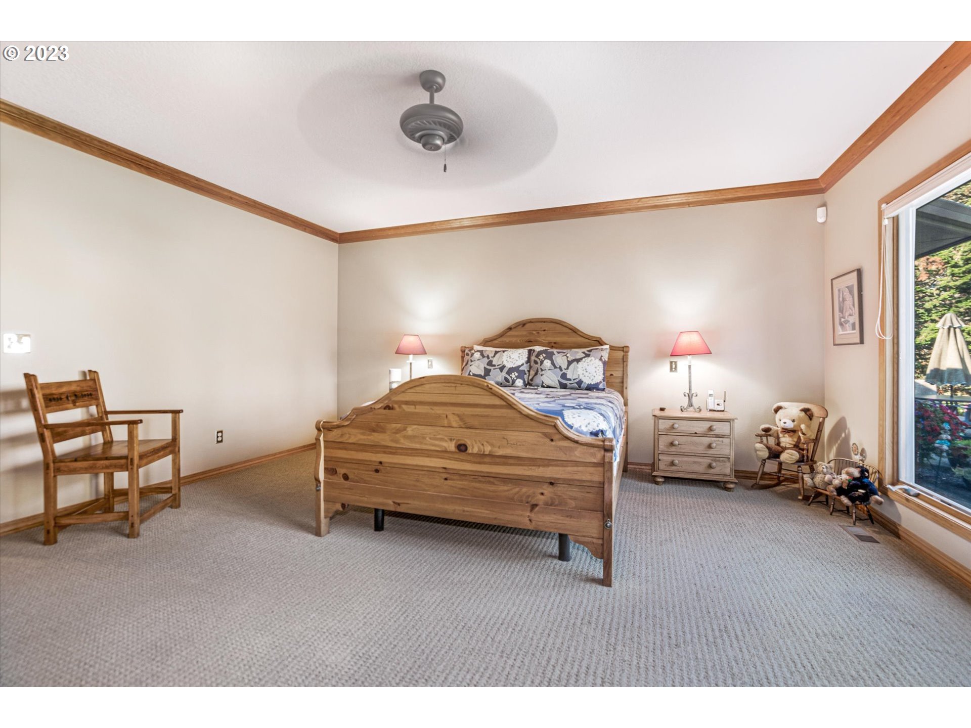 21100 South Summit Ridge Lane Oregon City, OR 97045 - Photo 21 of 32 a bedroom with a bed and a chair