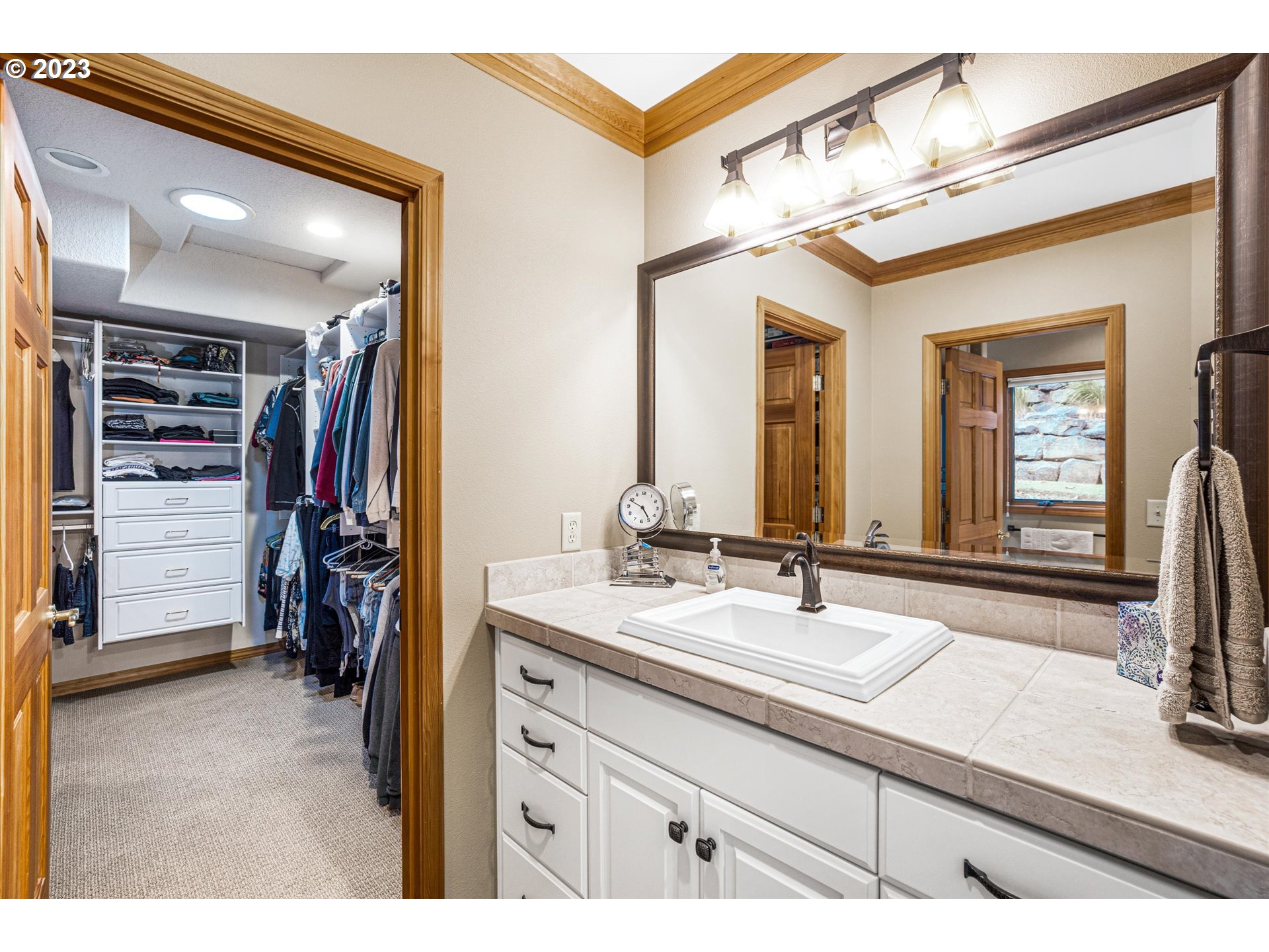 21100 South Summit Ridge Lane Oregon City, OR 97045 - Photo 23 of 32 a bathroom with a sink vanity and a mirror