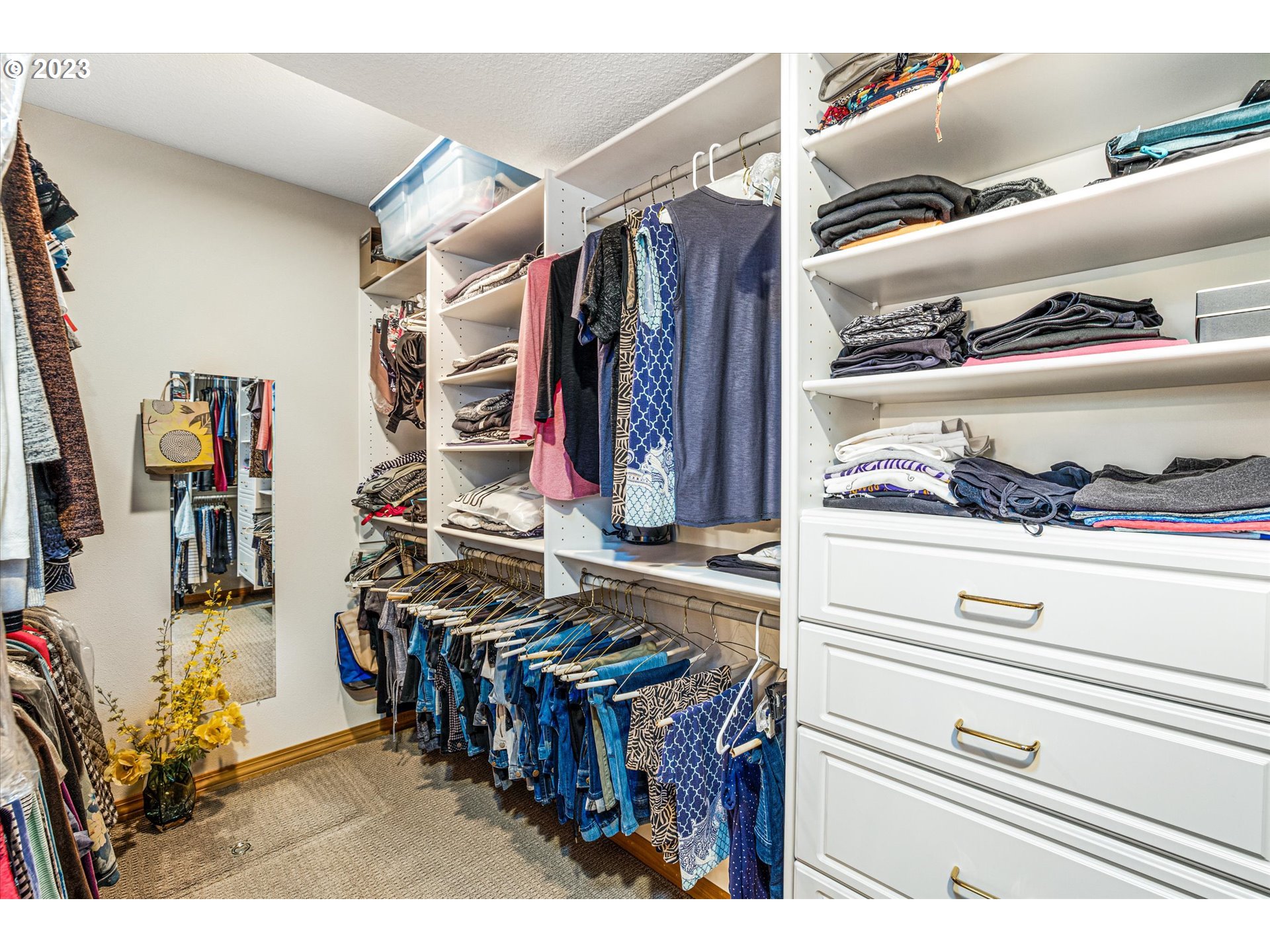 21100 South Summit Ridge Lane Oregon City, OR 97045 - Photo 24 of 32 a view of walk in closet with clothes and shoes