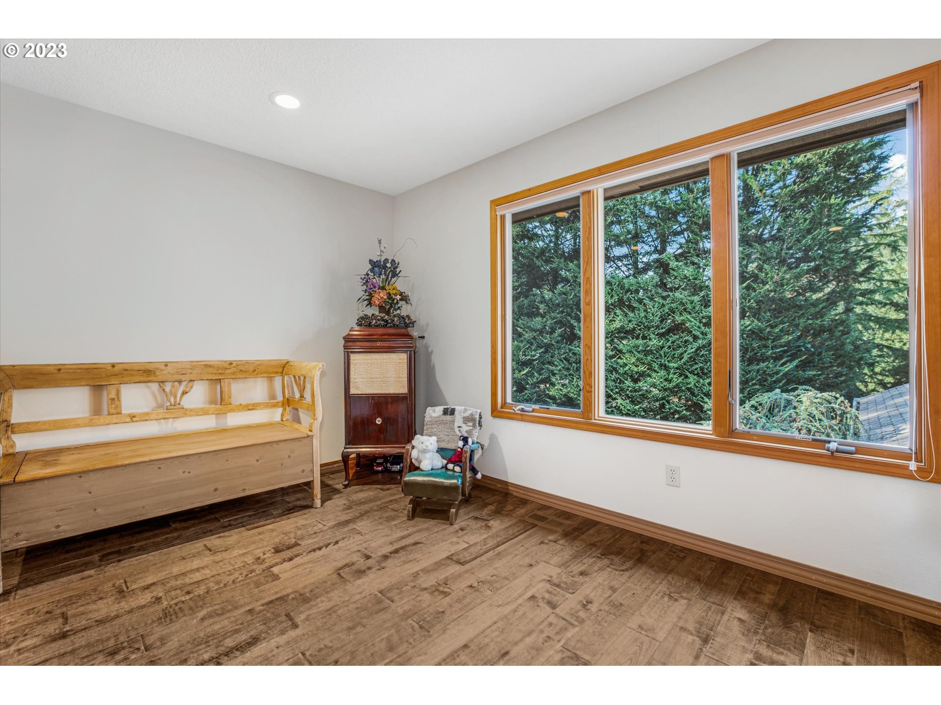21100 South Summit Ridge Lane Oregon City, OR 97045 - Photo 27 of 32 a view of empty room with wooden floor and windows