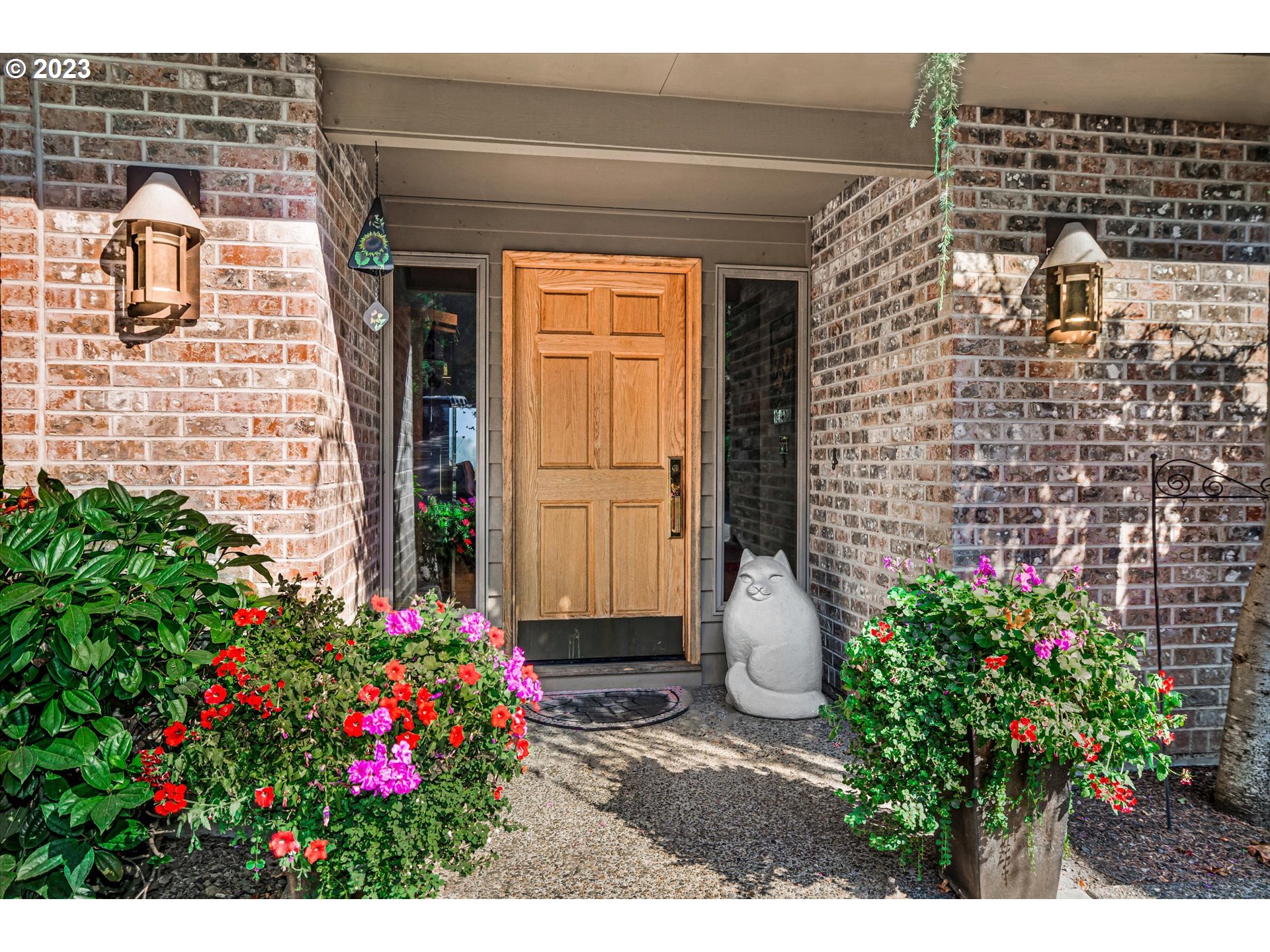 21100 South Summit Ridge Lane Oregon City, OR 97045 - Photo 4 of 32 a view of front door of house and flowers