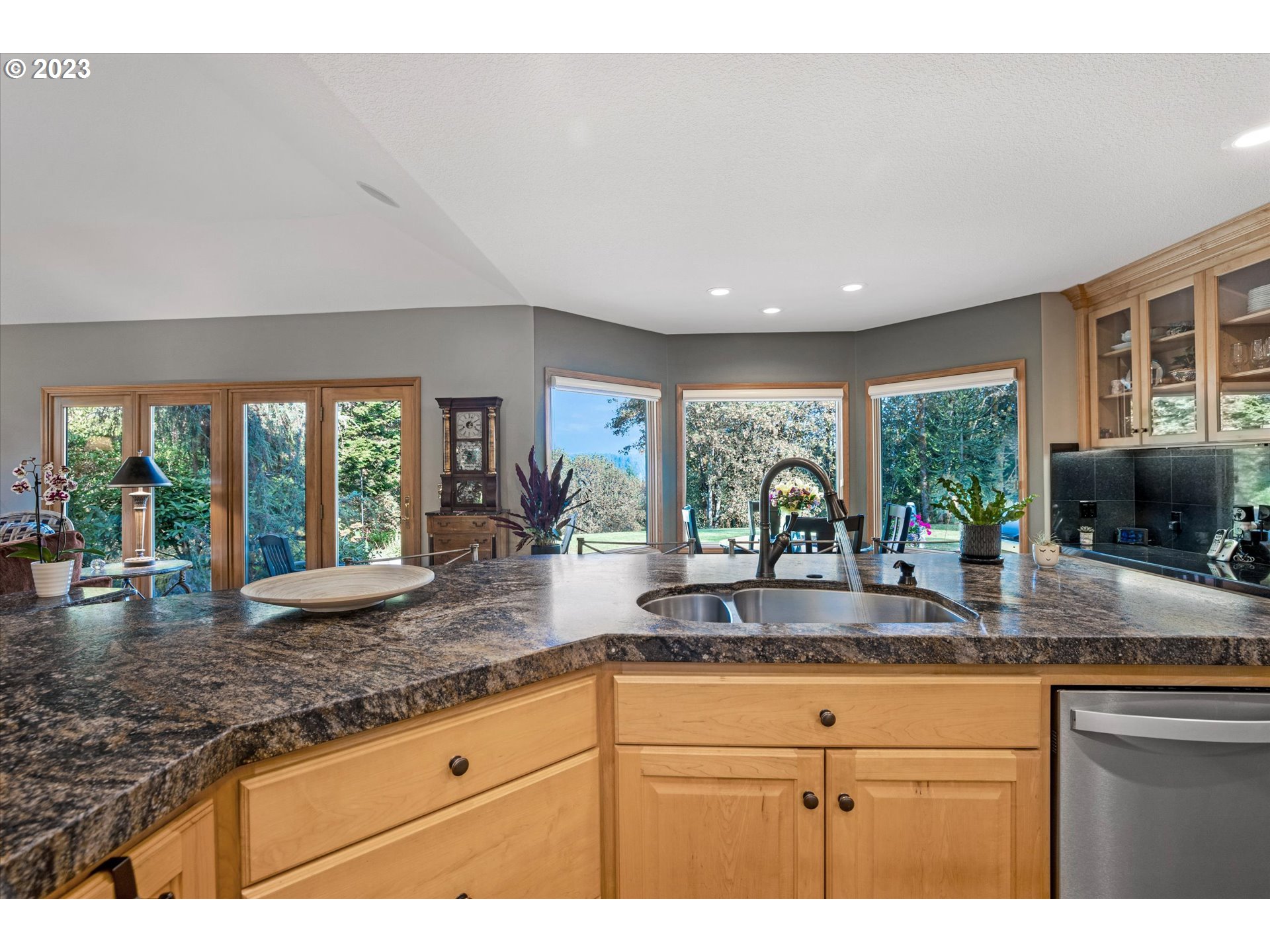 21100 South Summit Ridge Lane Oregon City, OR 97045 - Photo 10 of 32 a kitchen with sink and large window