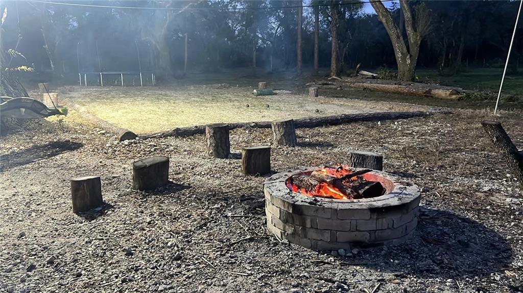 2115 Cr 78 Road North LaBelle, FL 33935 - Photo 10 of 10 View of yard with a fire pit