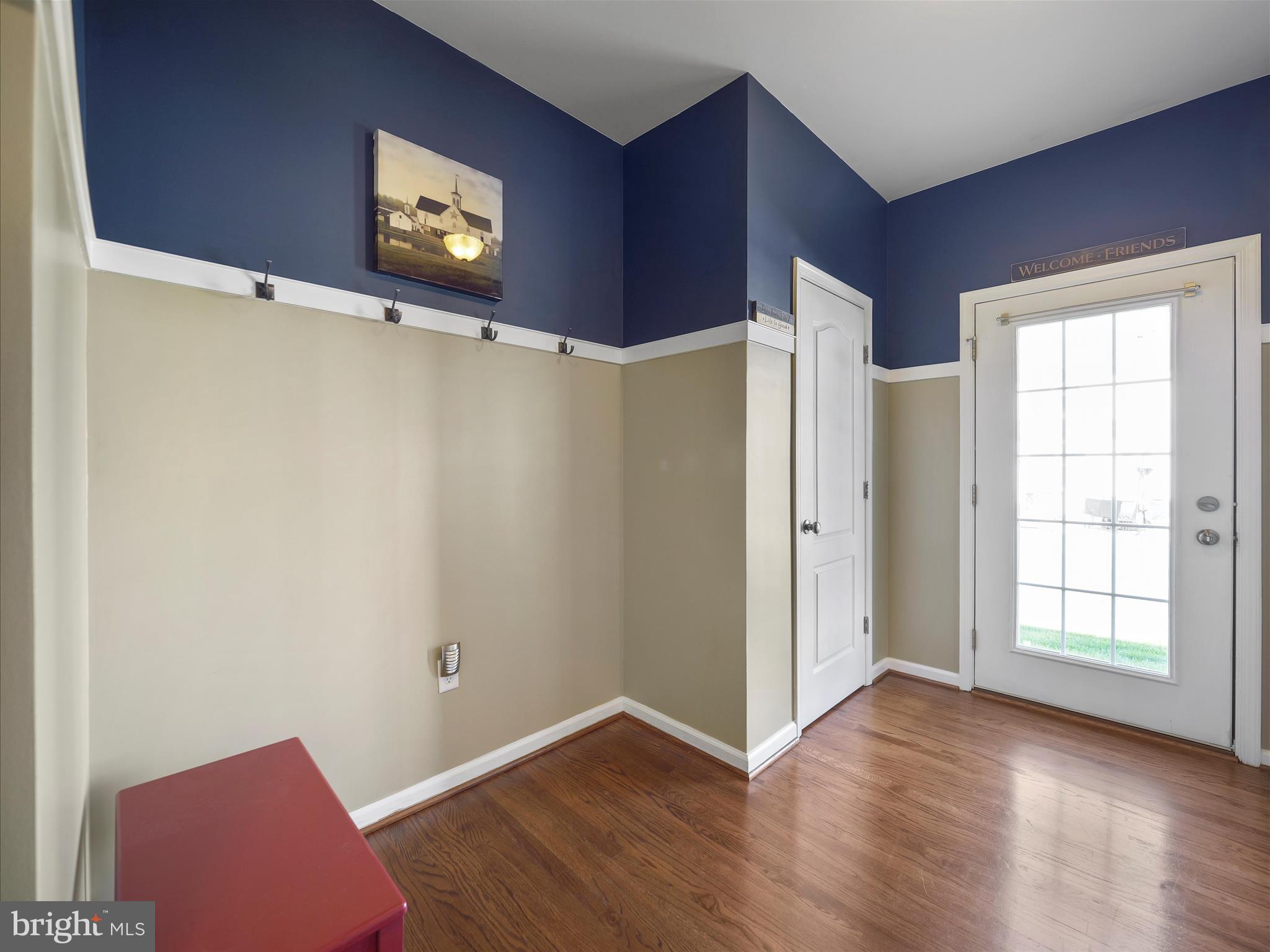 6200 Payton Way Frederick, MD 21703 - Photo 14 of 62 a view of an empty room with wooden floor and a window
