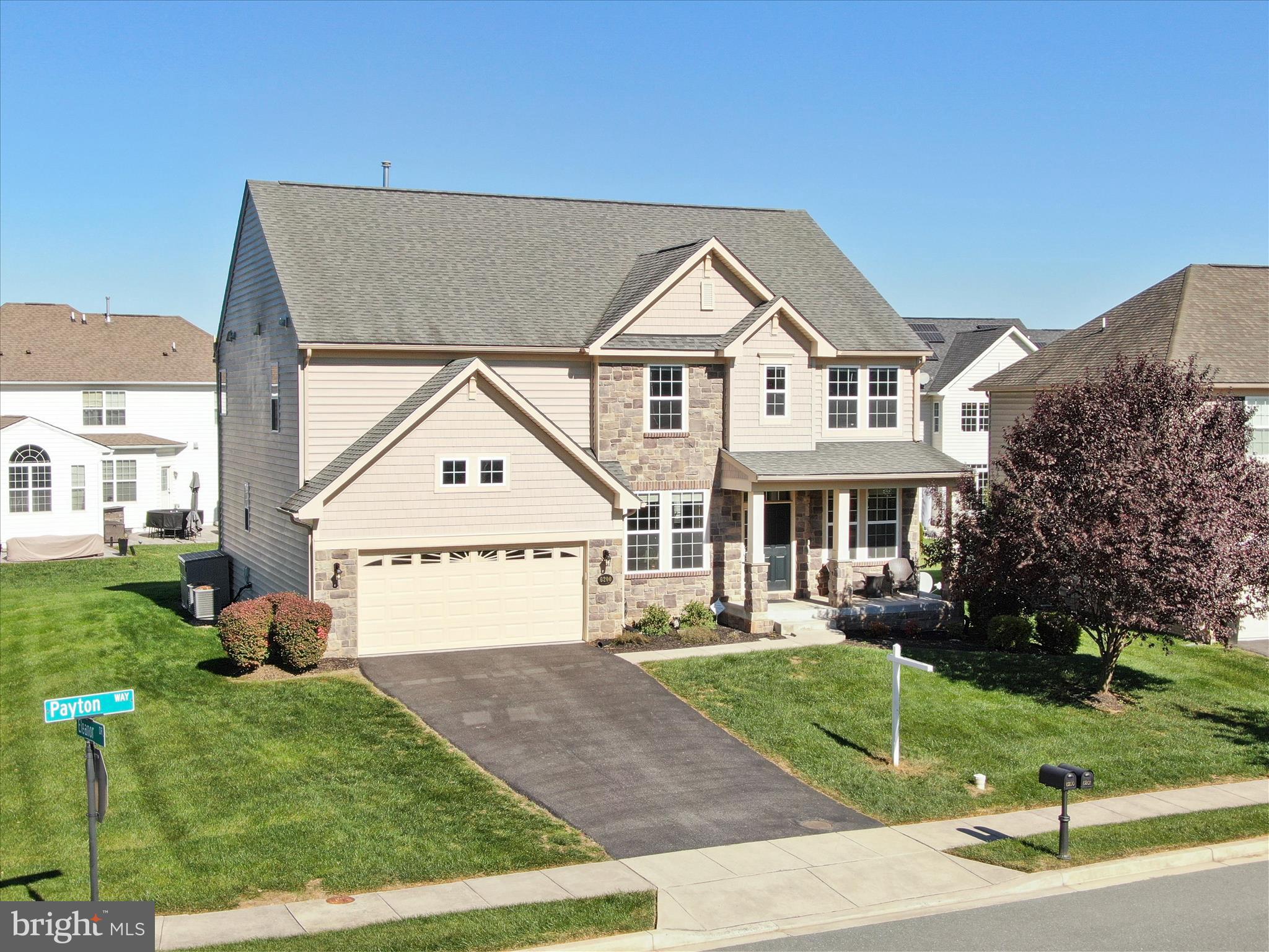 6200 Payton Way Frederick, MD 21703 - Photo 2 of 62 a front view of a house with a yard and trees