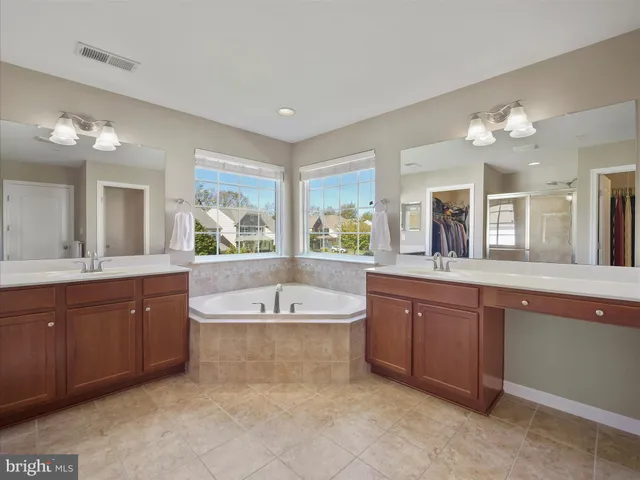 a view of a livingroom with a walk in closet and bedroom