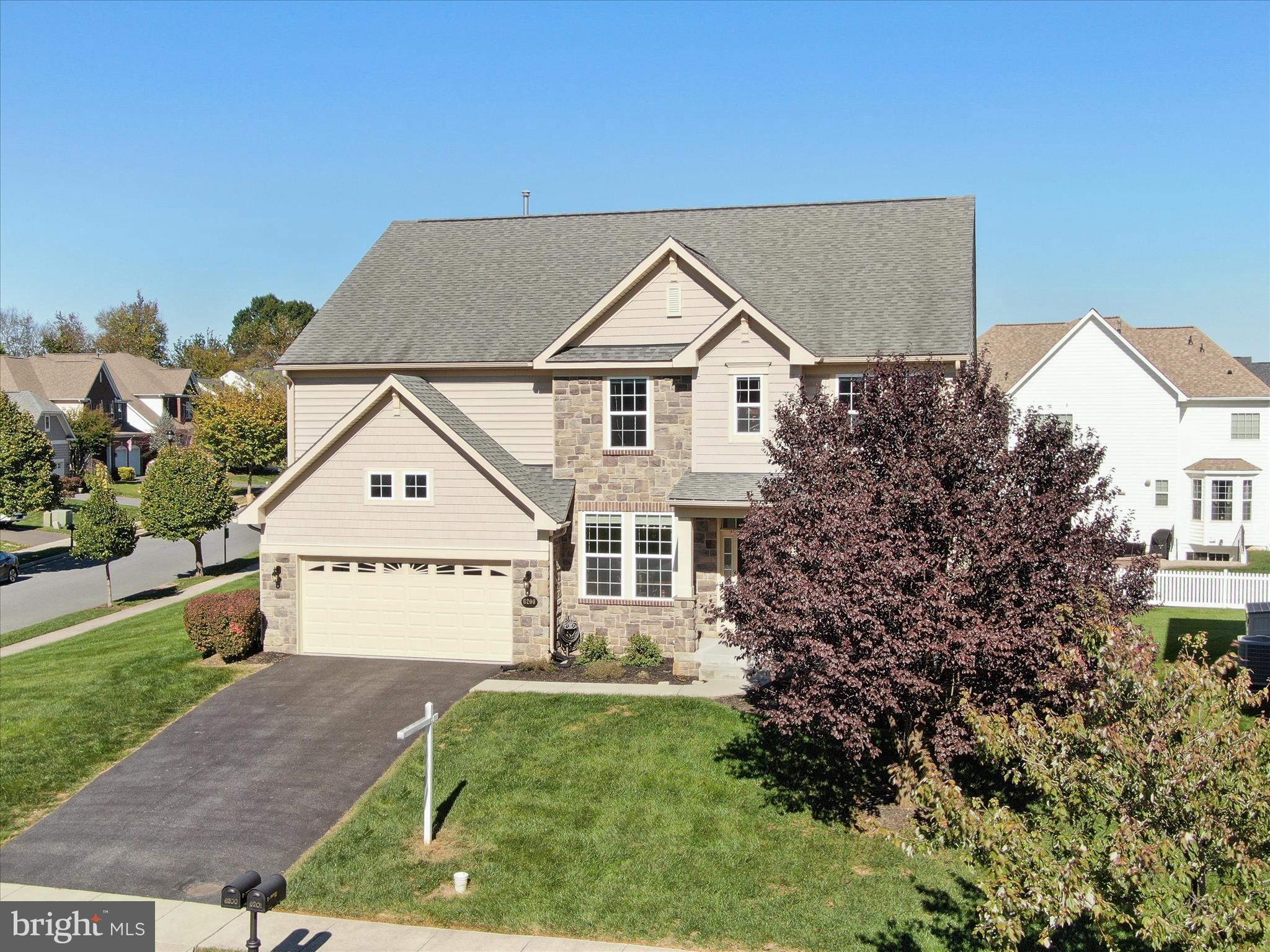 6200 Payton Way Frederick, MD 21703 - Photo 4 of 62 a view of a house with a yard and potted plants