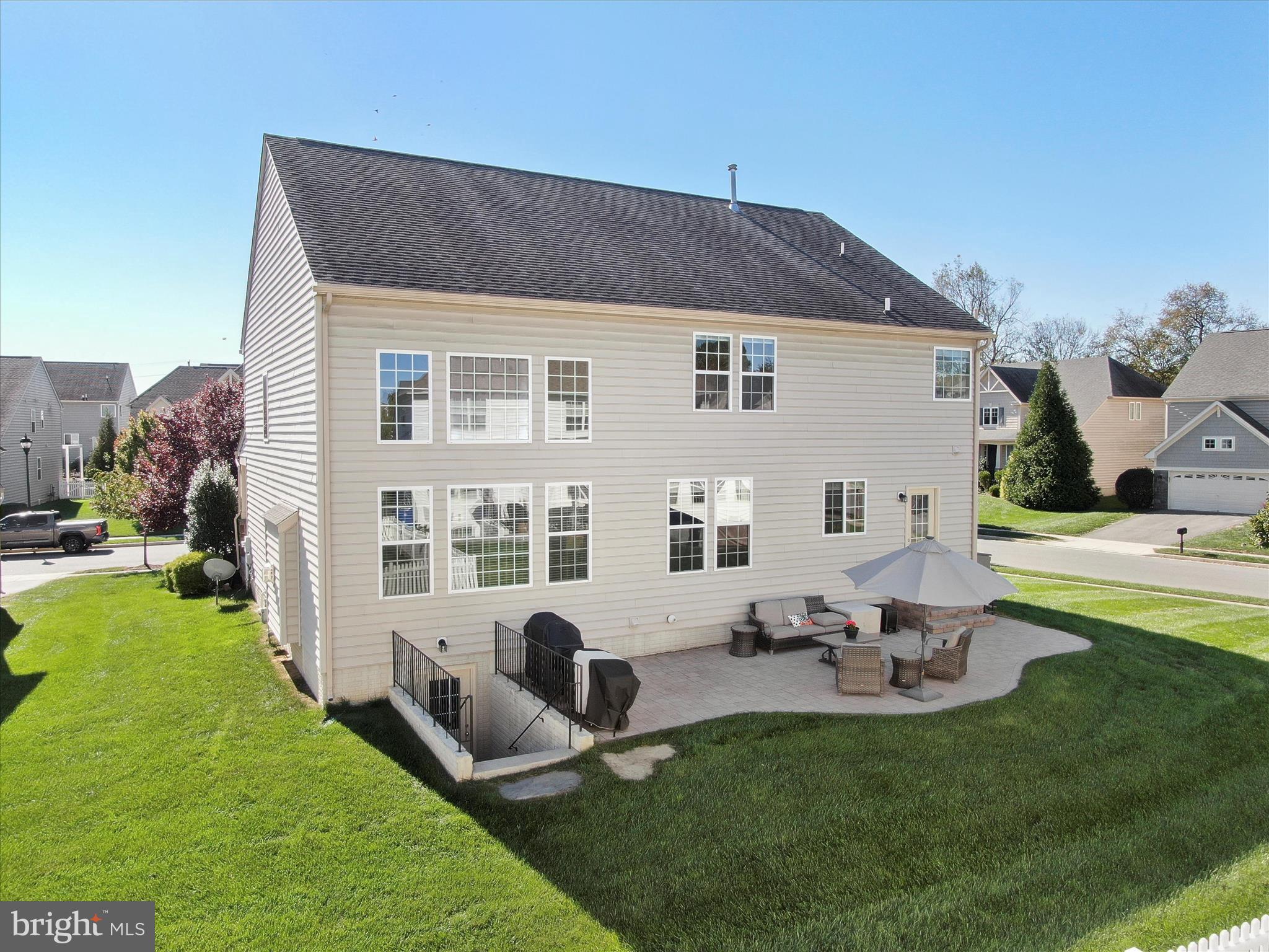 6200 Payton Way Frederick, MD 21703 - Photo 43 of 62 a front view of house with a garden and patio
