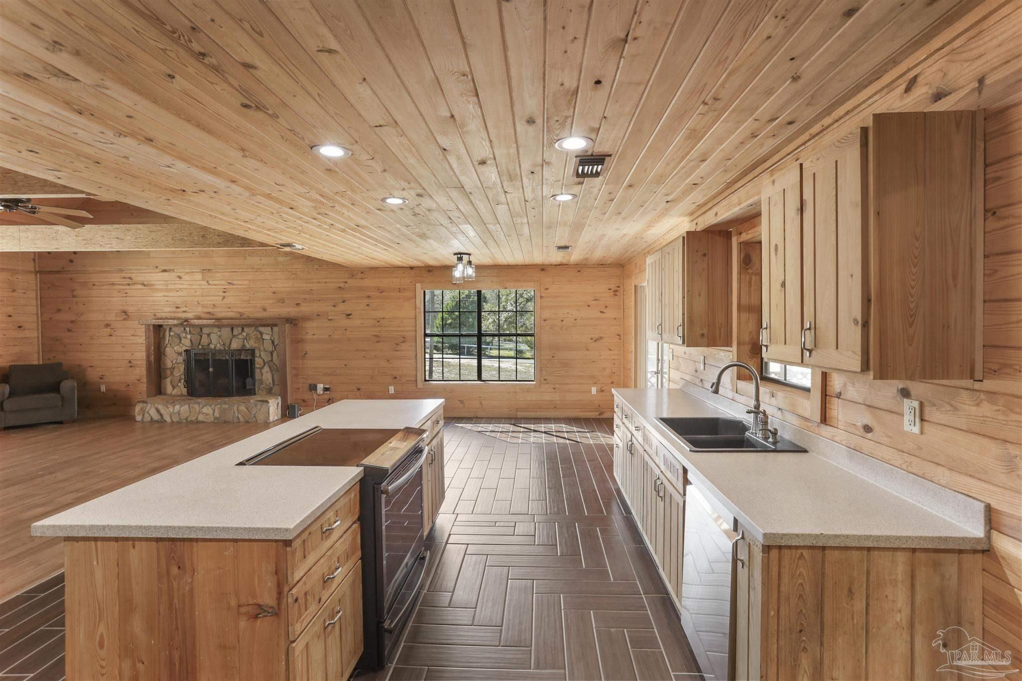 6856 Martin Road Milton, FL 32570 - Photo 14 of 50 a spacious bathroom with a sink and a large mirror