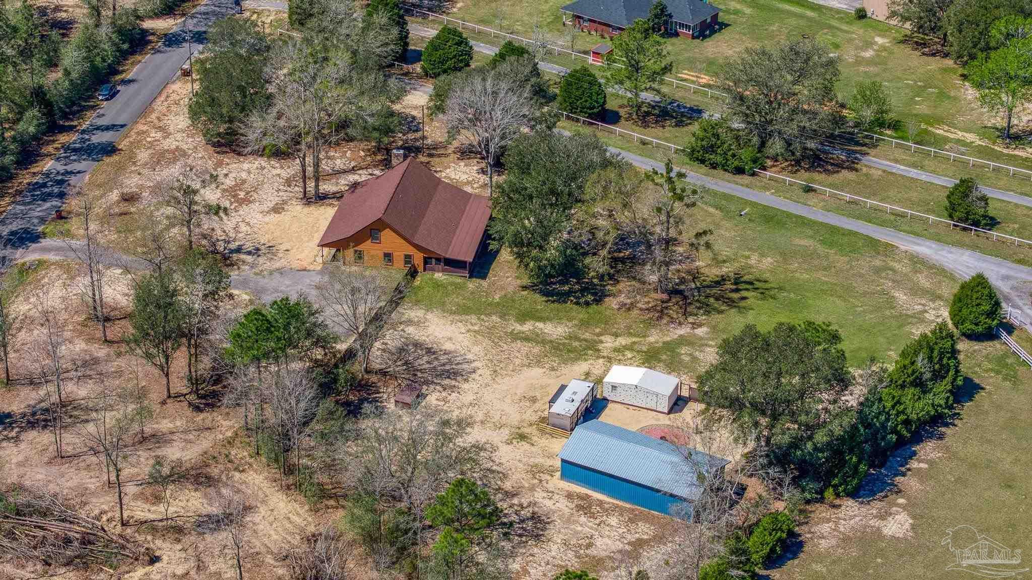 6856 Martin Road Milton, FL 32570 - Photo 3 of 50 an aerial view of a house with a yard