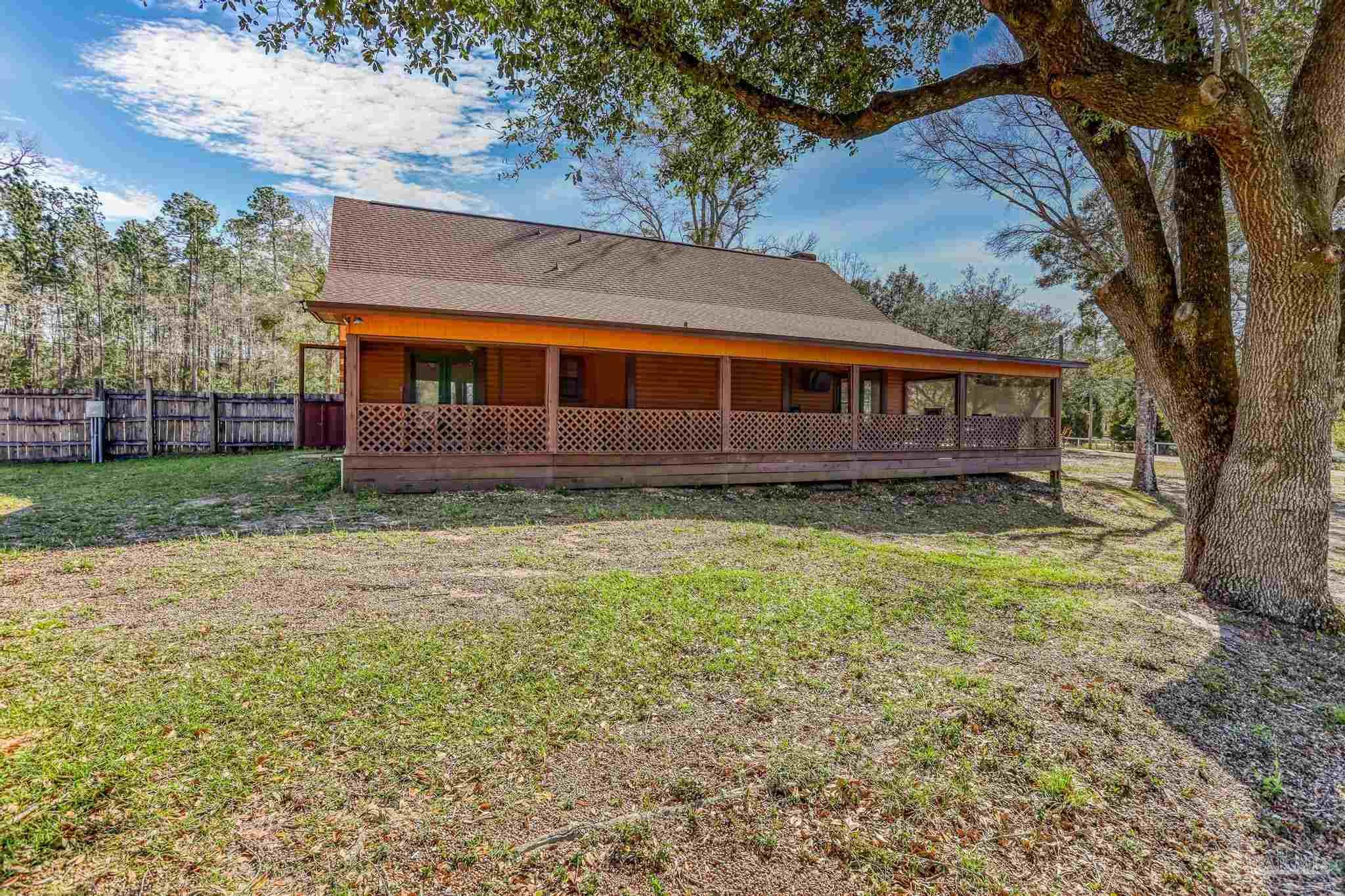 6856 Martin Road Milton, FL 32570 - Photo 33 of 50 front view of a house with a yard