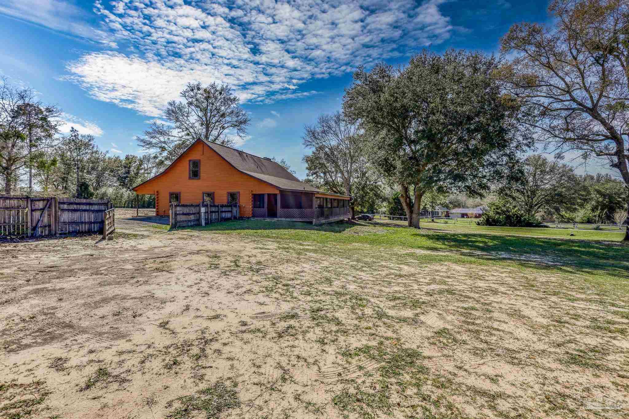 6856 Martin Road Milton, FL 32570 - Photo 34 of 50 a front view of a house with a yard