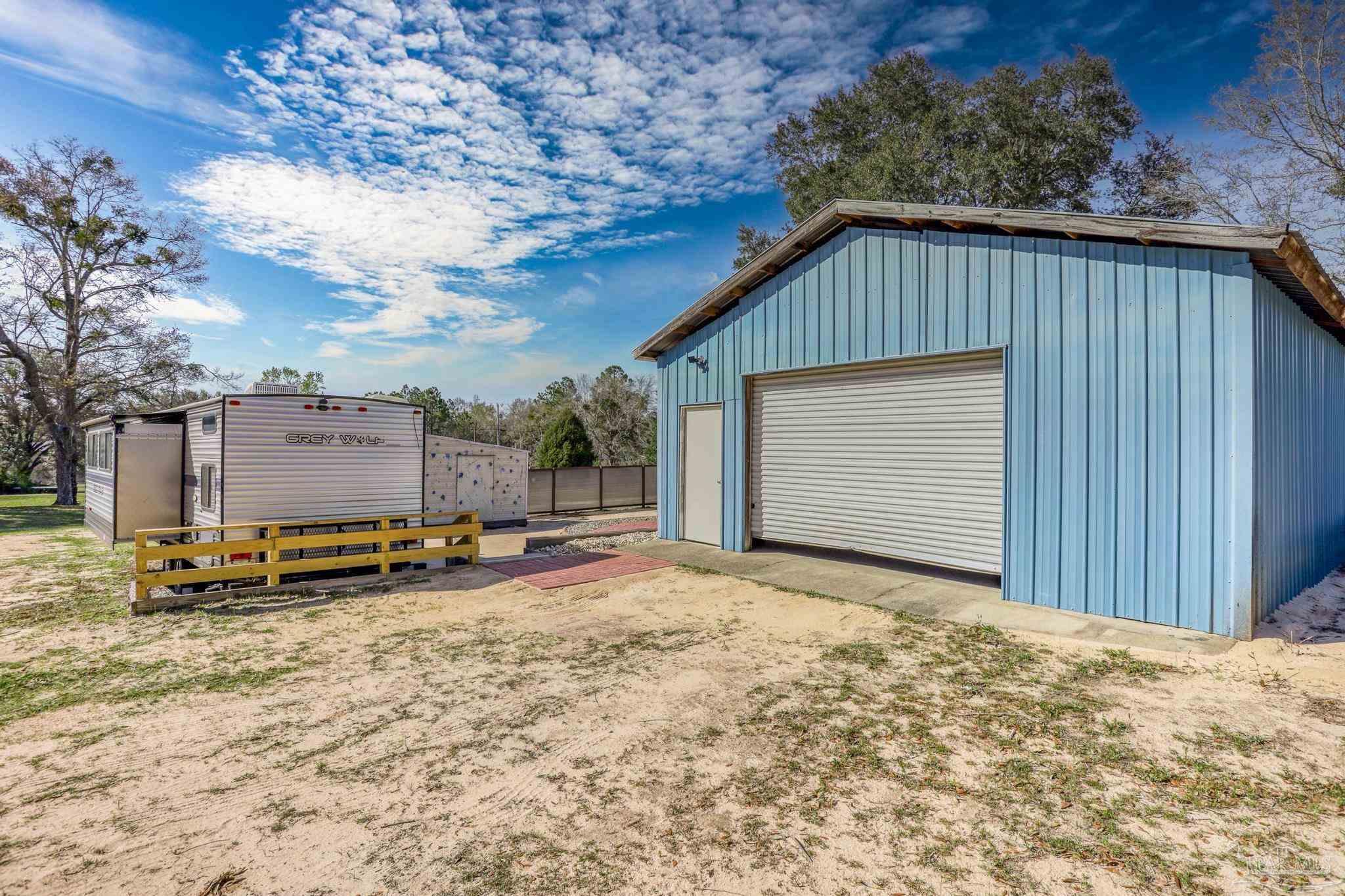 6856 Martin Road Milton, FL 32570 - Photo 39 of 50 a backyard of a house