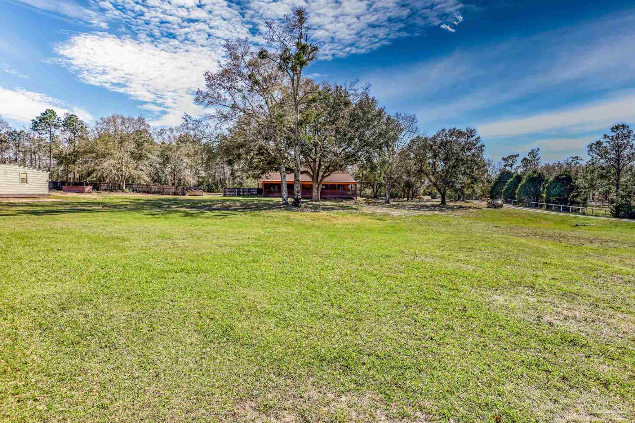 6856 Martin Road Milton, FL 32570 - Photo 45 of 50 a view of a swimming pool and an outdoor seating