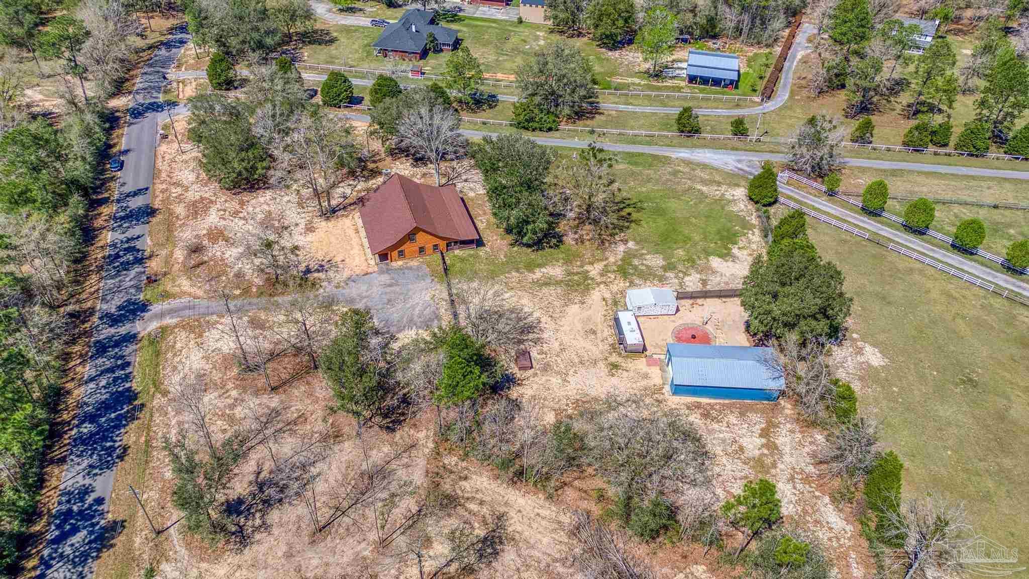 6856 Martin Road Milton, FL 32570 - Photo 46 of 50 an aerial view of residential house with outdoor space and lake view