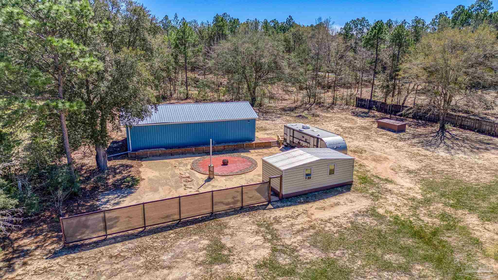 6856 Martin Road Milton, FL 32570 - Photo 49 of 50 a large green field with lots of trees