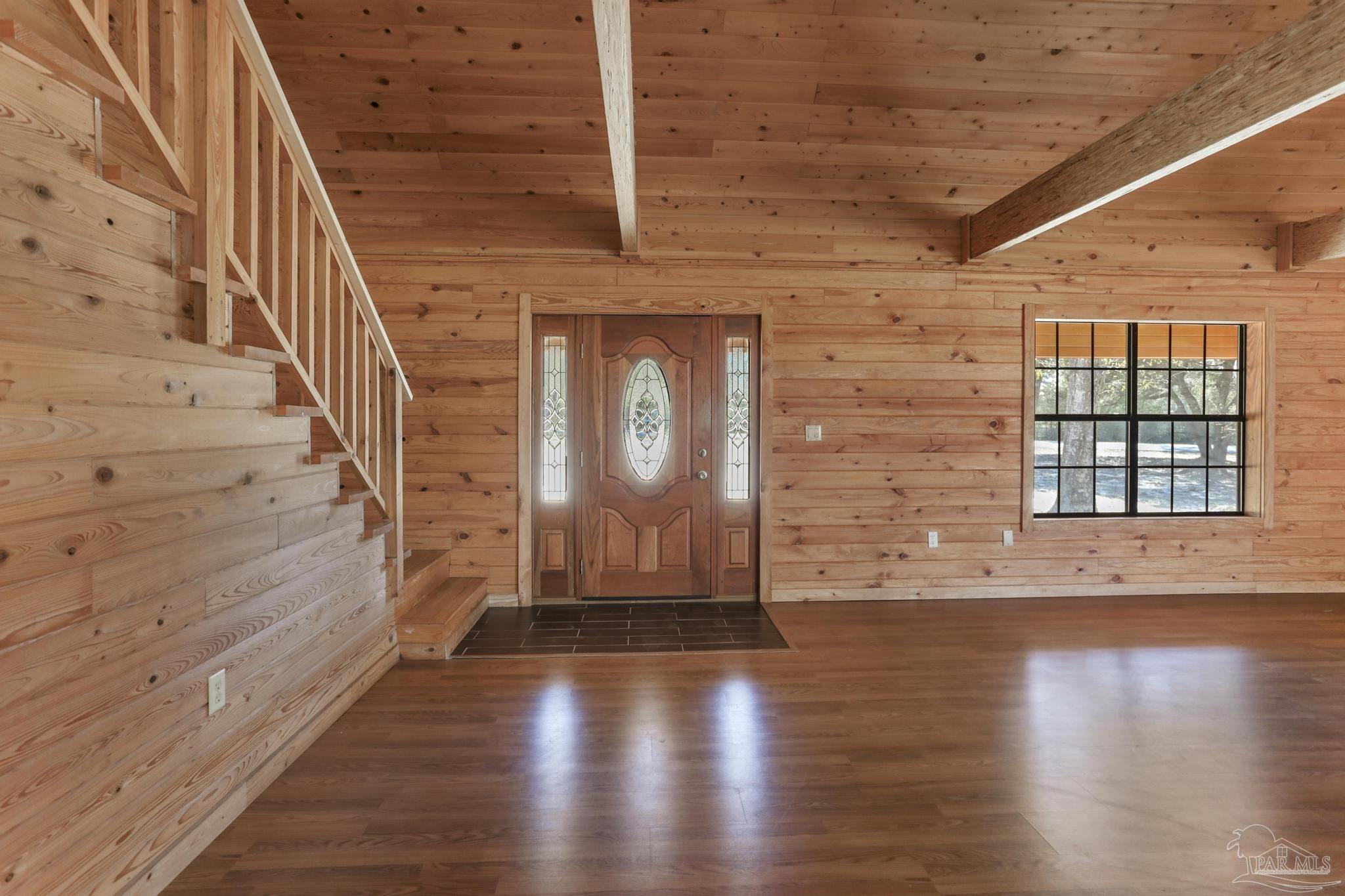 6856 Martin Road Milton, FL 32570 - Photo 5 of 50 a view of wooden floor with staircase