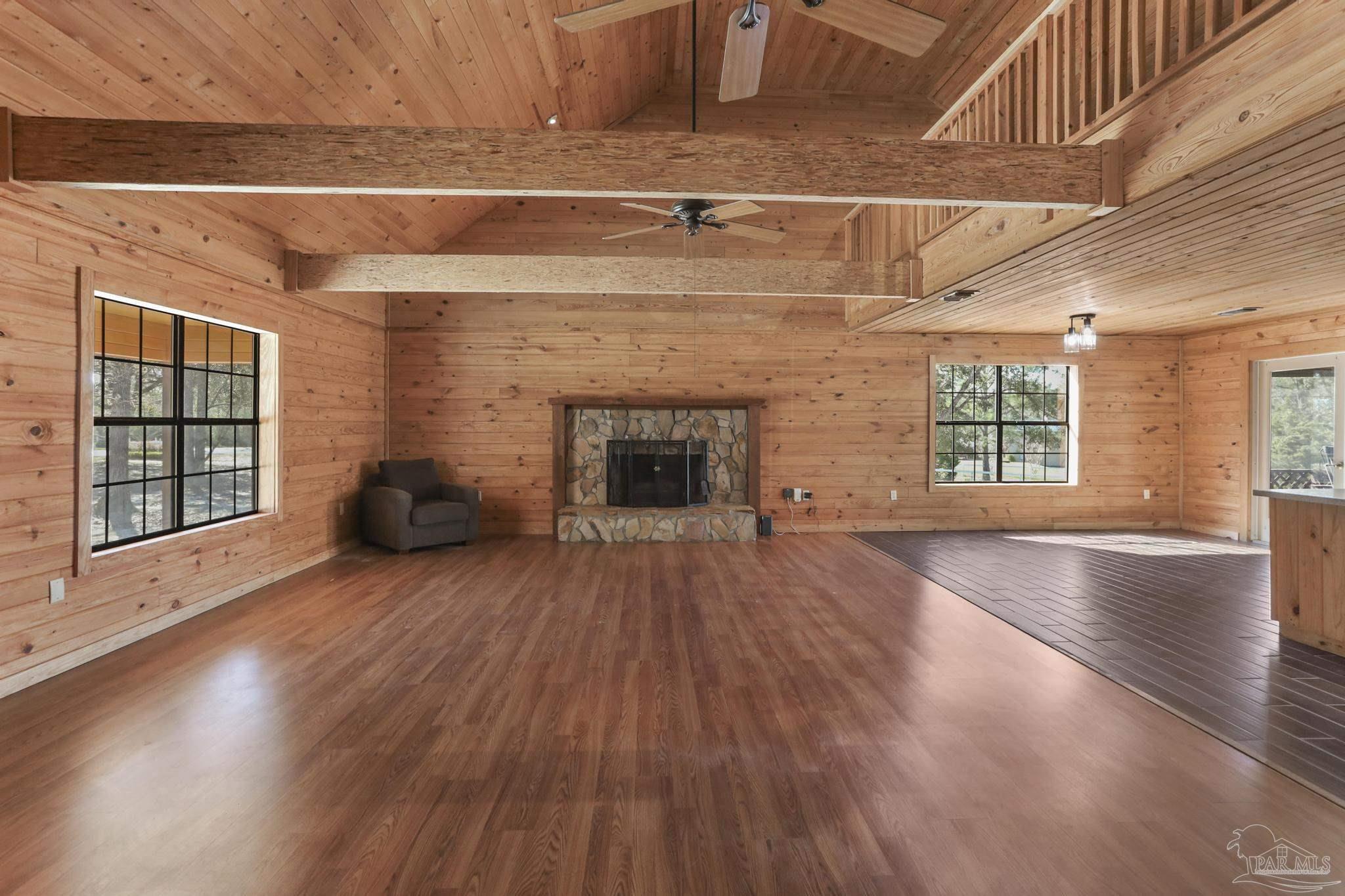 6856 Martin Road Milton, FL 32570 - Photo 7 of 50 an empty room with windows and fireplace