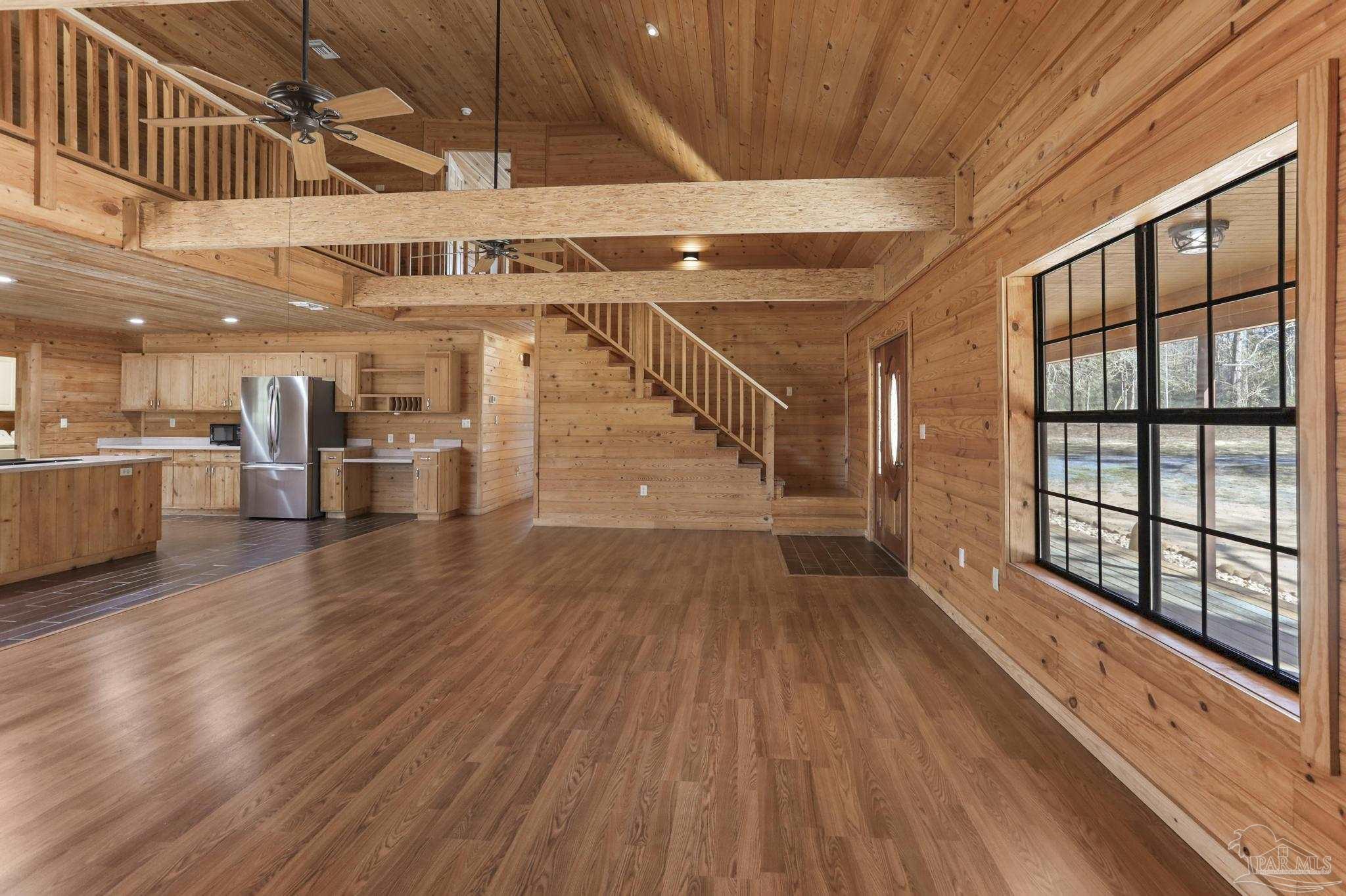 6856 Martin Road Milton, FL 32570 - Photo 8 of 50 a view of a hallway with wooden floor