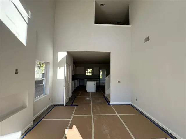 a bathroom with a granite countertop sink and a bathtub