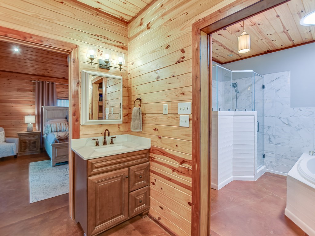 254 Middleton Road Spicewood, TX 78669 - Photo 14 of 32 a bathroom with a sink and a mirror