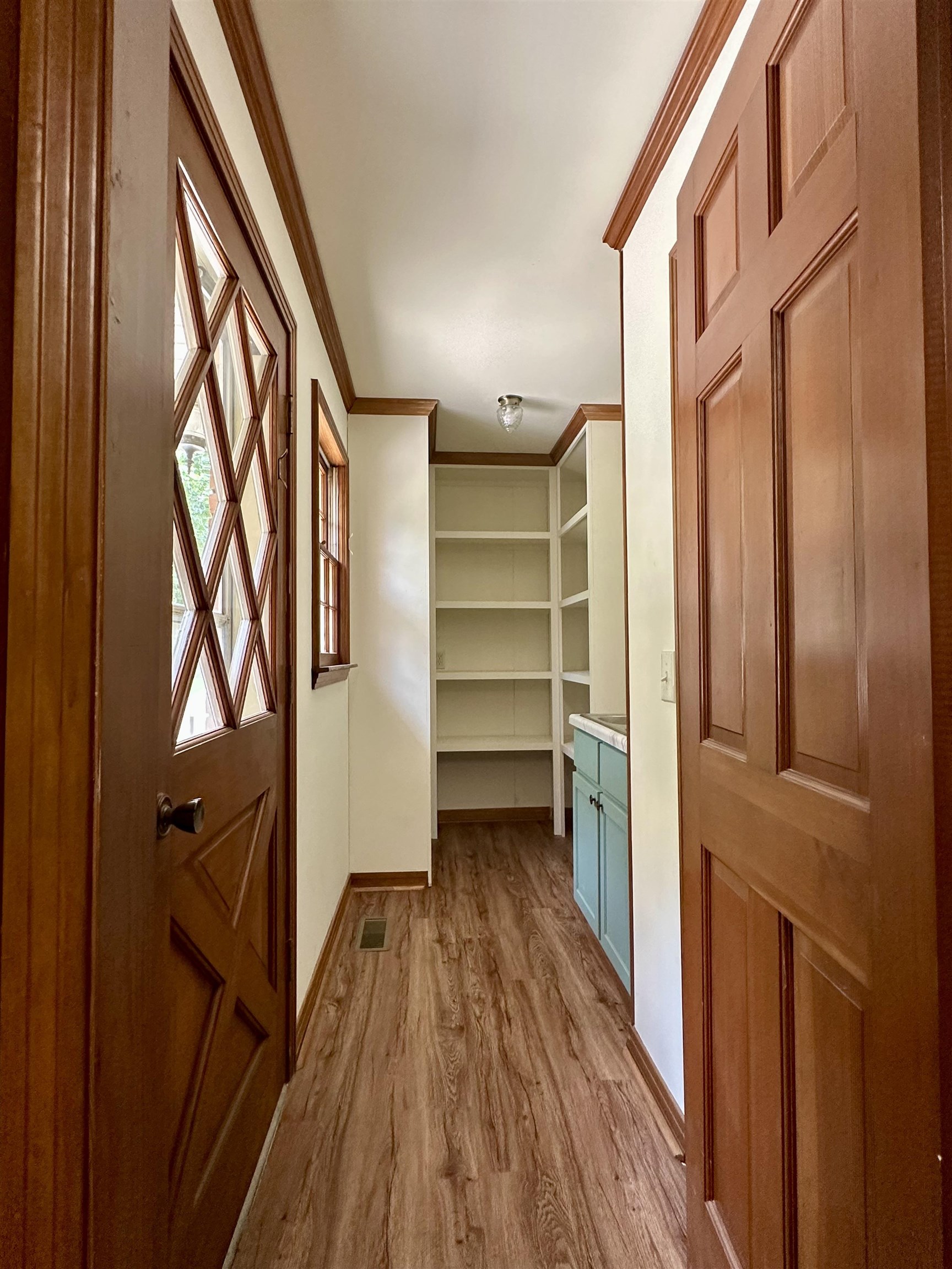 808 West Main Street Adamsville, TN 38310 - Photo 17 of 37 a view of walk in closet with wooden floor and staircase