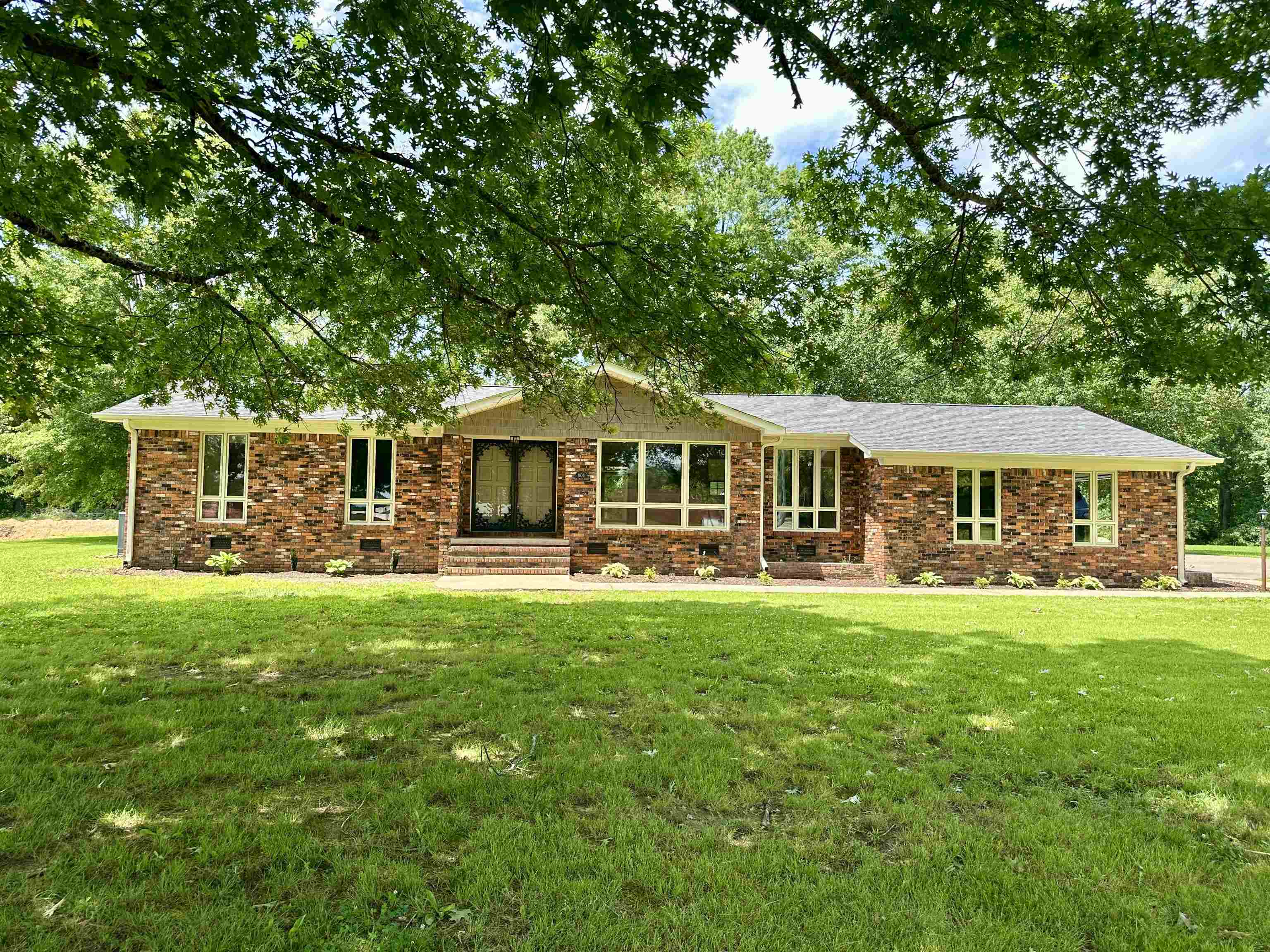 808 West Main Street Adamsville, TN 38310 - Photo 18 of 37 Ranch-style house with a front lawn