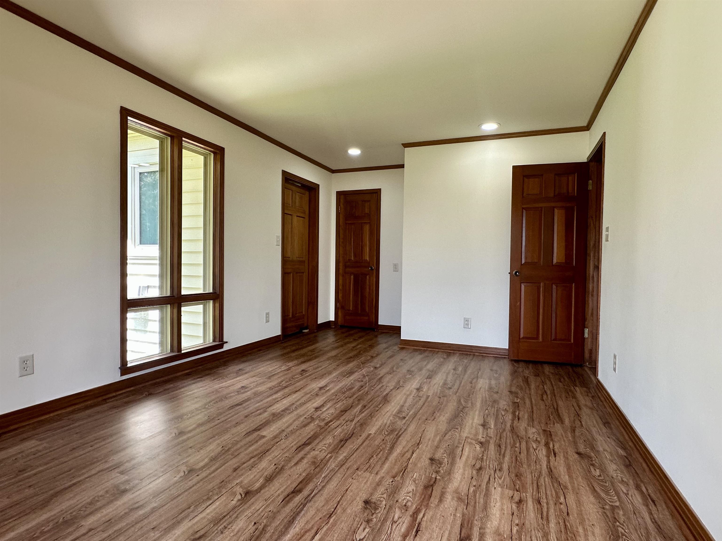 808 West Main Street Adamsville, TN 38310 - Photo 30 of 37 Unfurnished bedroom with crown molding, wood finished floors, and recessed lighting