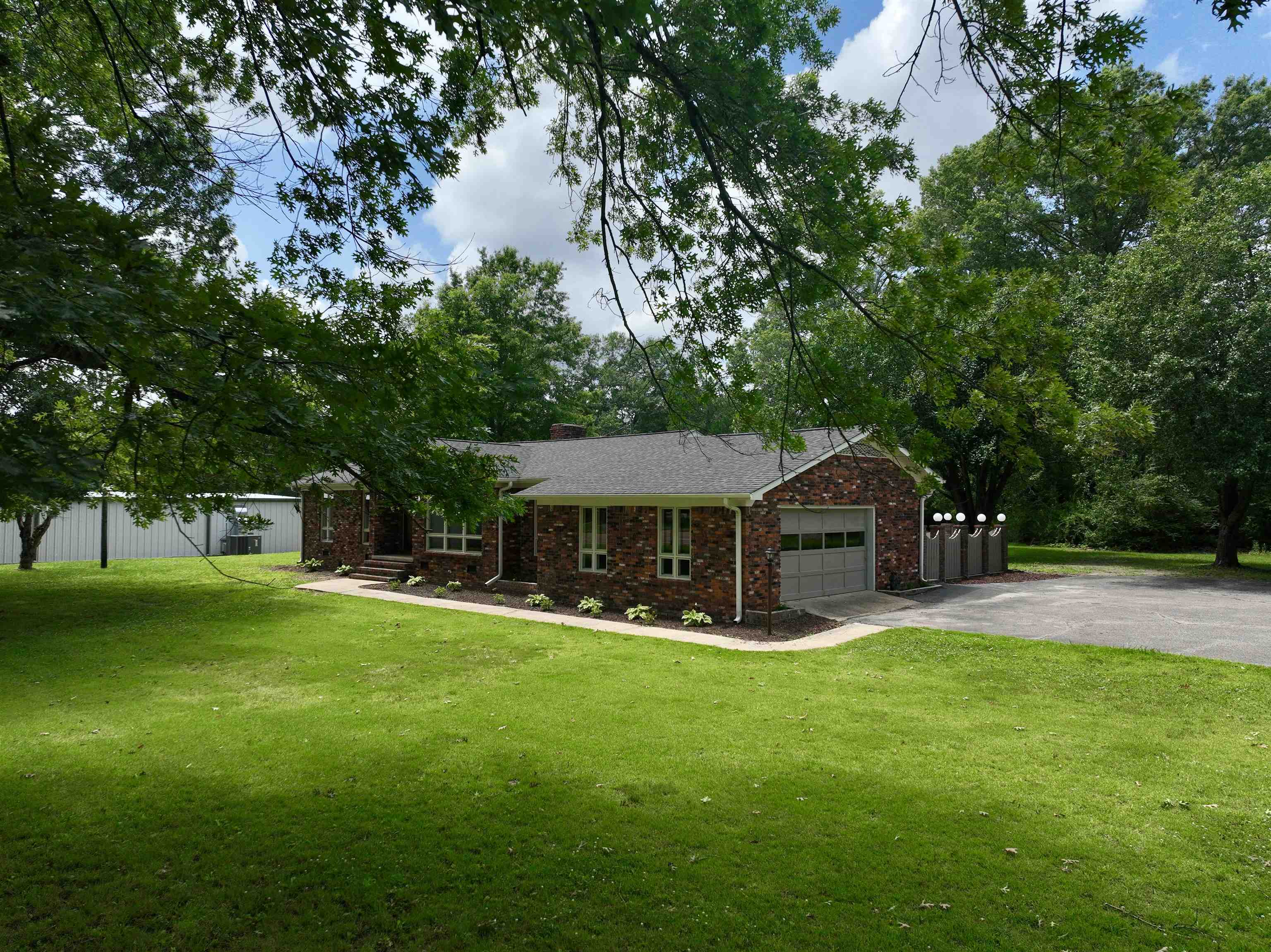 808 West Main Street Adamsville, TN 38310 - Photo 4 of 37 a view of a house with a yard porch and sitting area