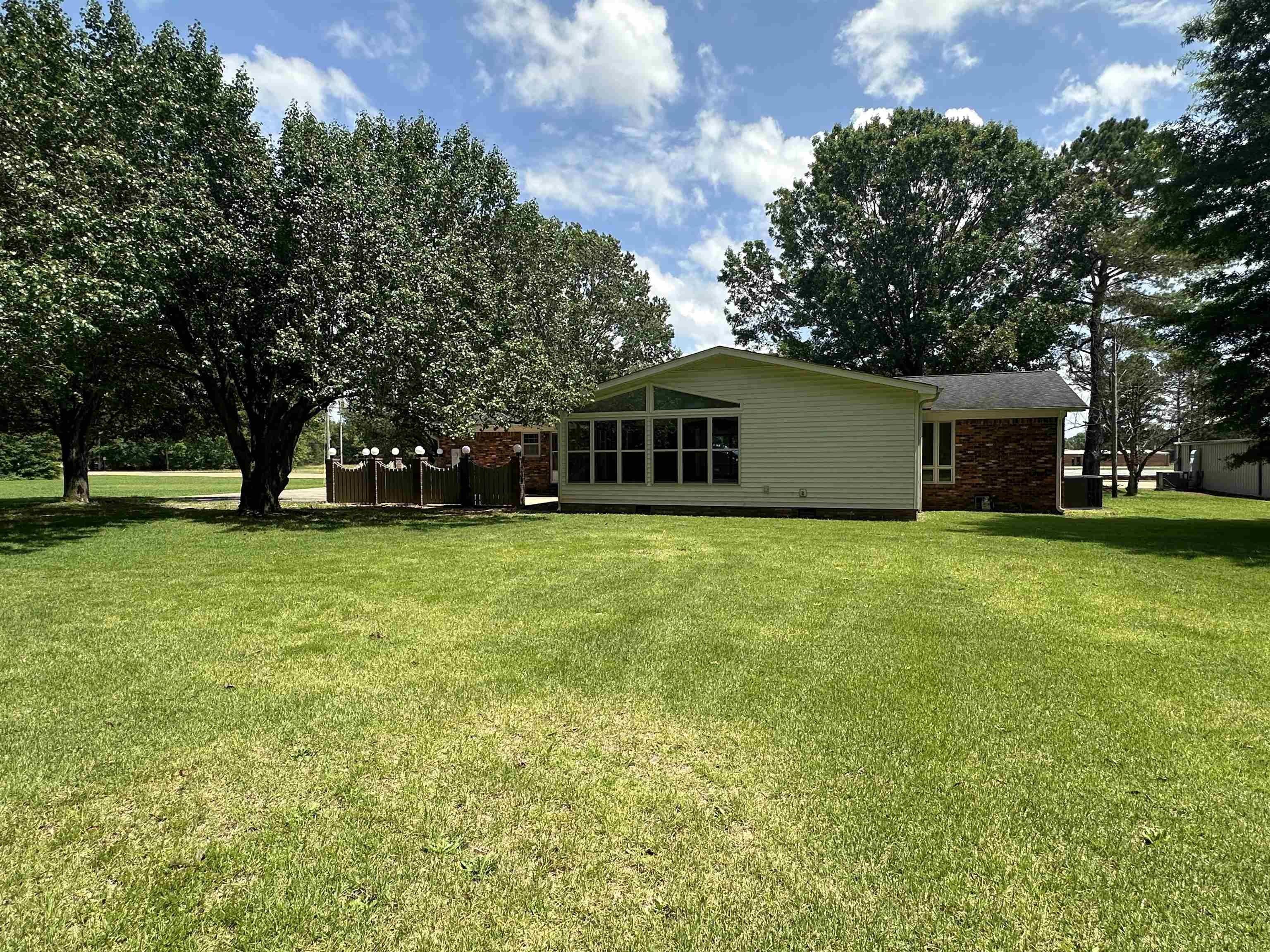 808 West Main Street Adamsville, TN 38310 - Photo 7 of 37 Back of house featuring a yard