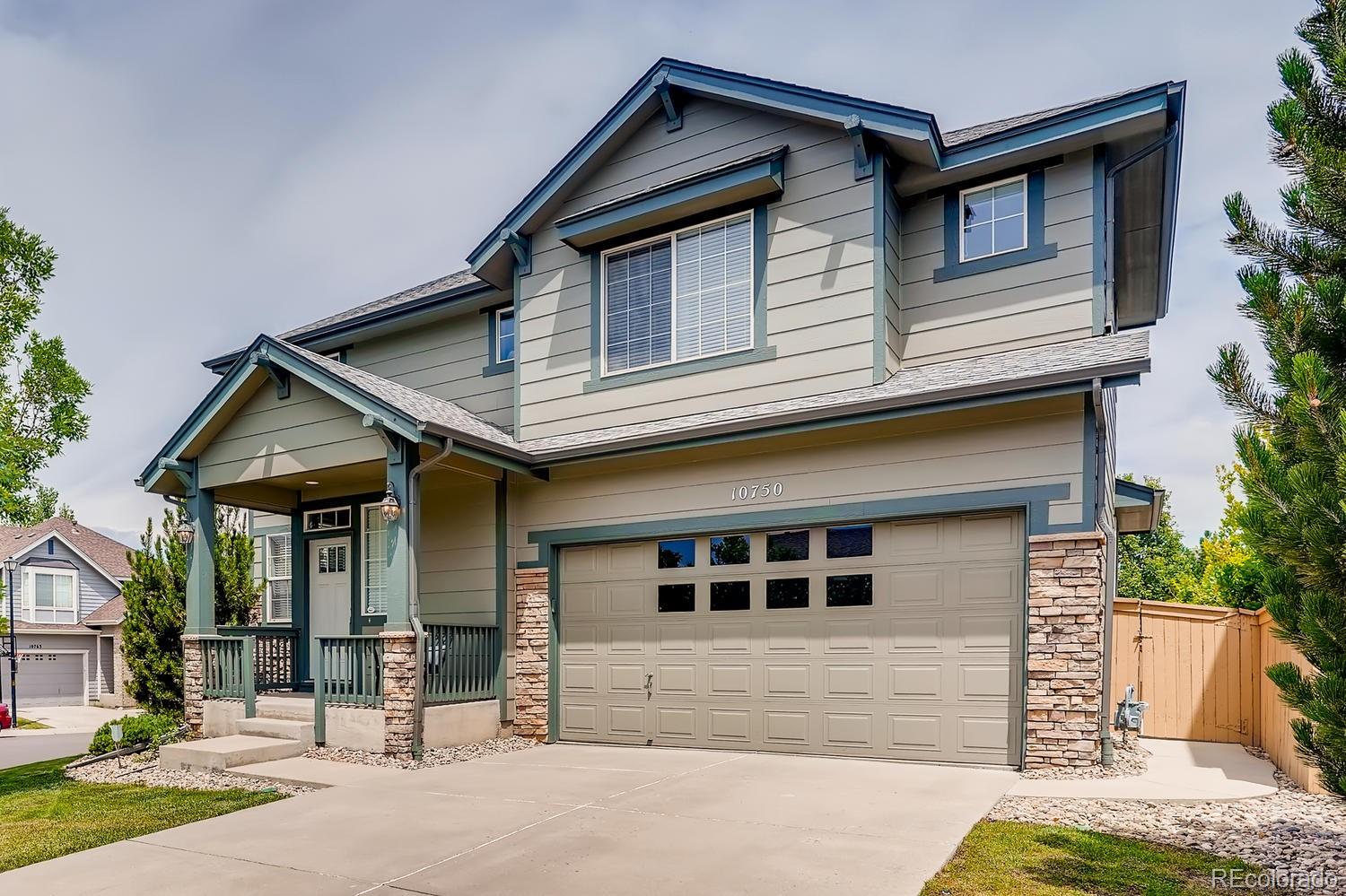 10750 Riverbrook Circle Highlands Ranch, CO 80126 - Photo 1 of 28 a front view of a house with a yard